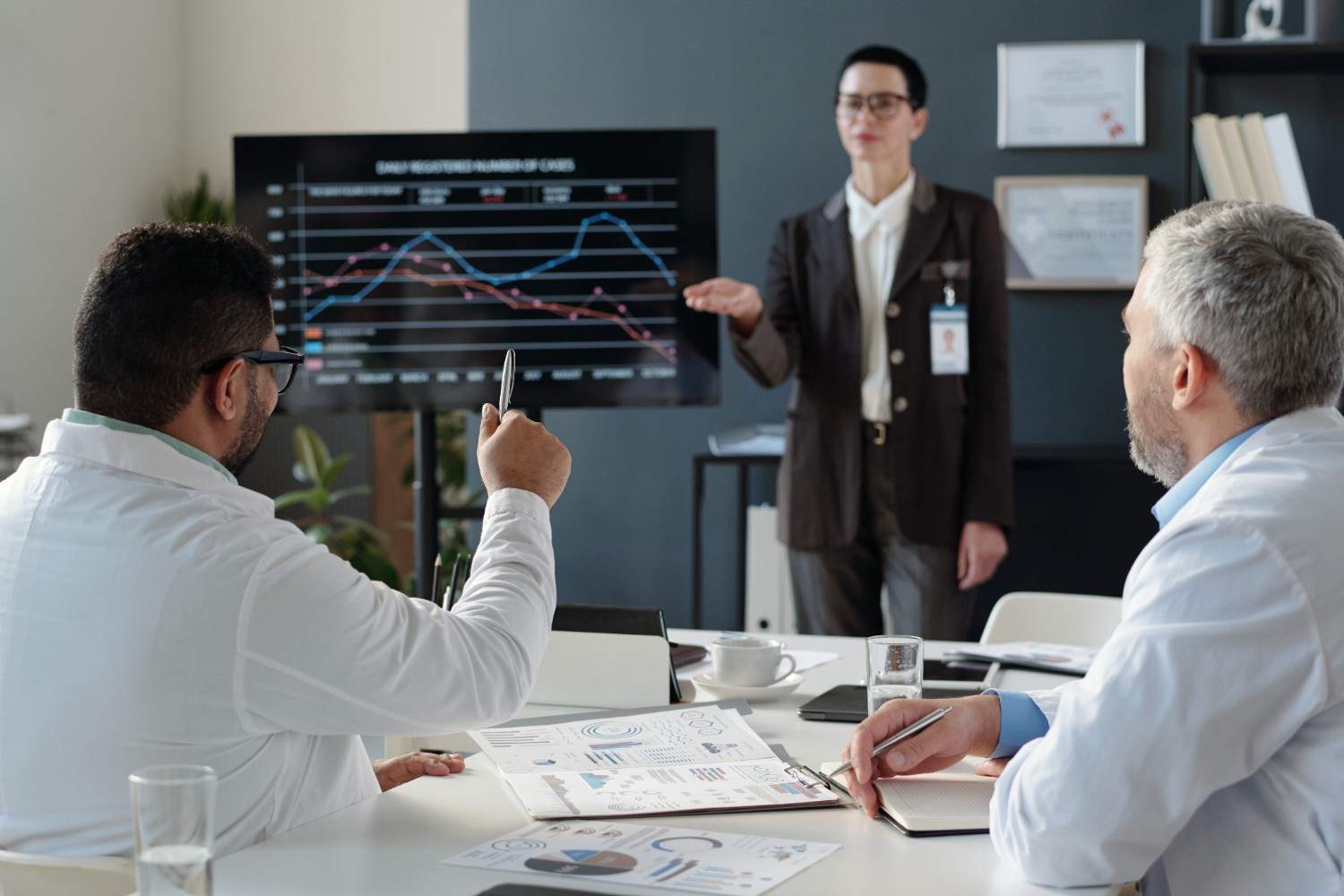 Purchased-services-cost-reduction-dashboard-in-hospital-boardroom